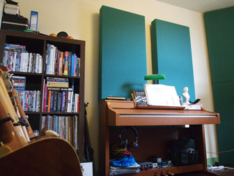 corner bass traps and acoustic wall panels in home studio